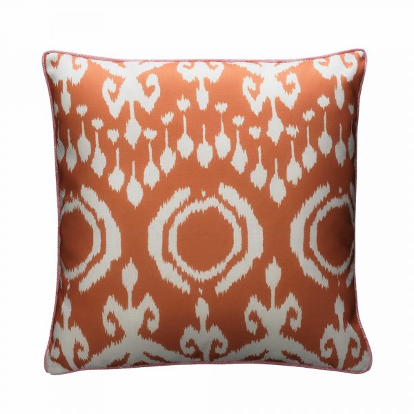 orange outdoor cushion in bold ikat design