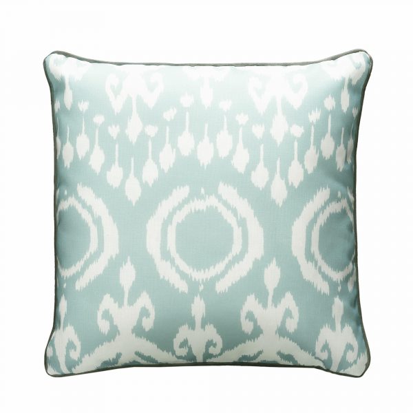 Outdoor cushion in bold, pale blue ikat design with grey piping