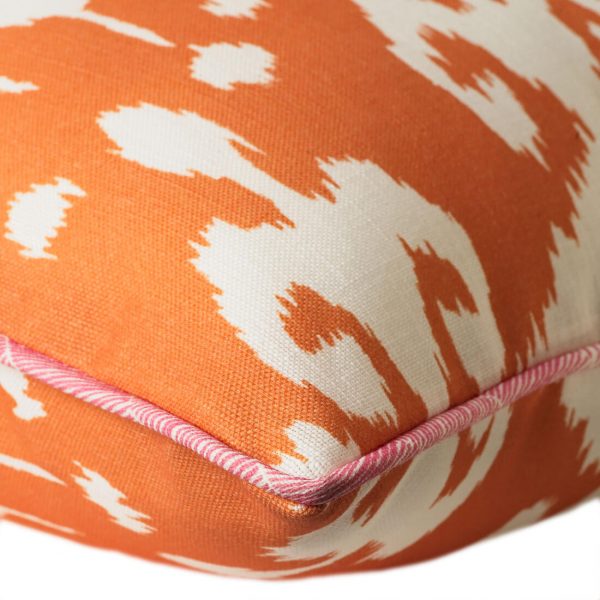 orange outdoor cushion in bold ikat design
