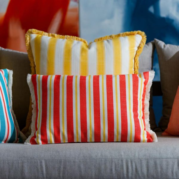 outdoor bolster cushion in orange stripes