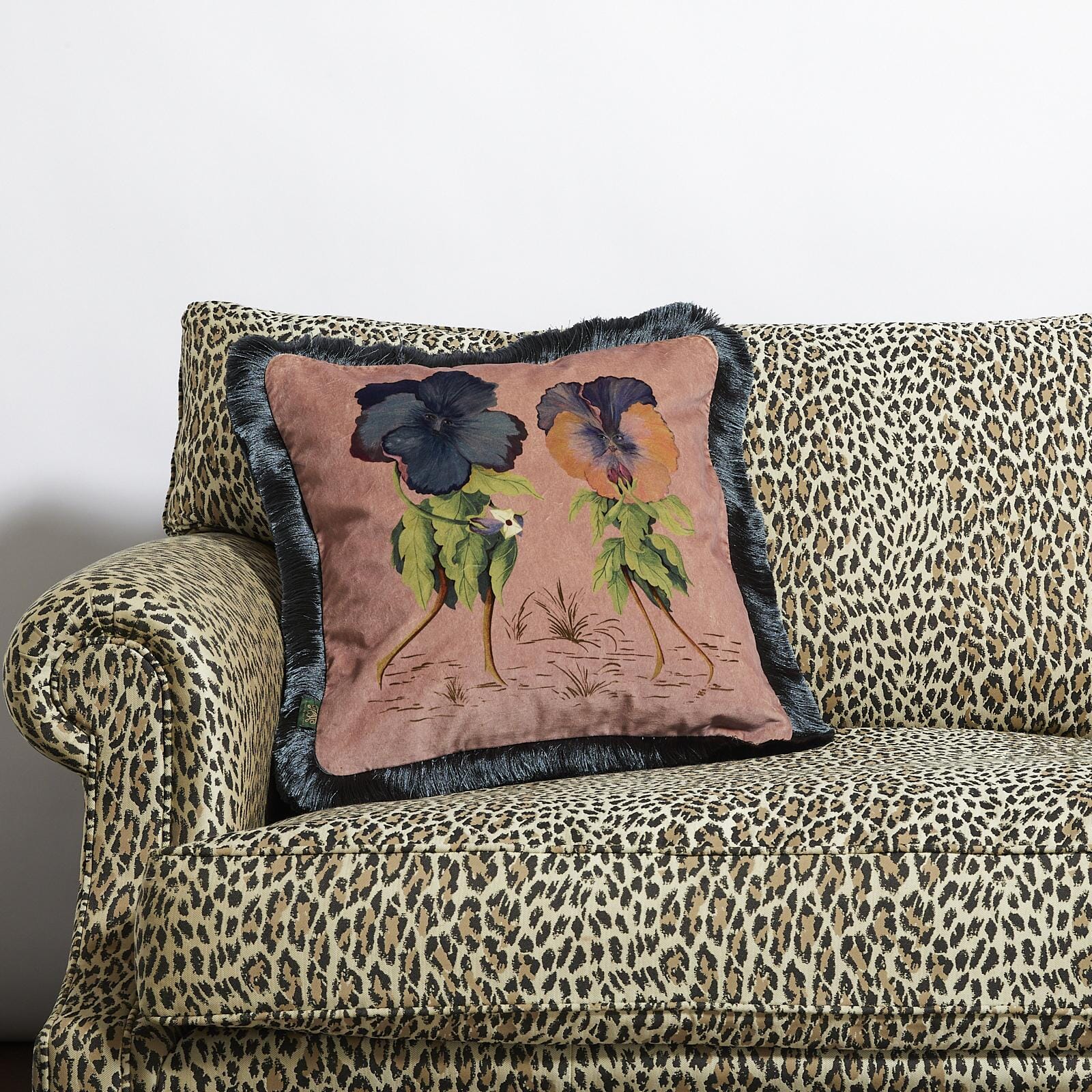 pink velvet cushion with luxurious fringe from house of hackney