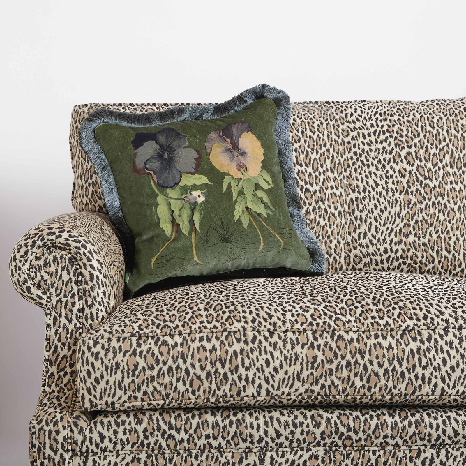 green velvet cushion with luxurious fringe from house of hackney