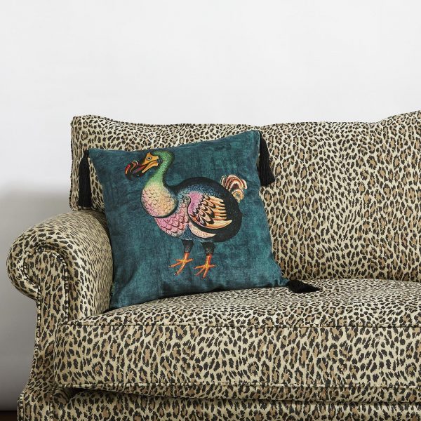 tasselled velvet cushion in petrol blue from House of Hackney